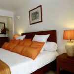 Villa Tropic 2 bedroom bed with decorative cushions